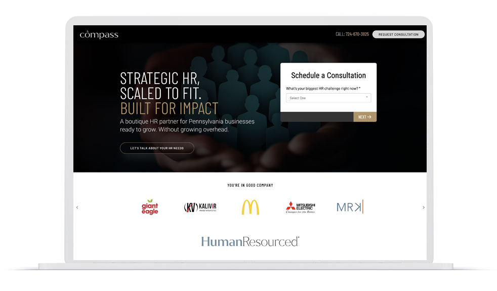 Compass HR consulting landing page on a laptop